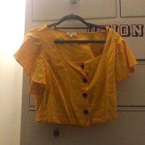 Yellow button down blouse with ruffle sleeves